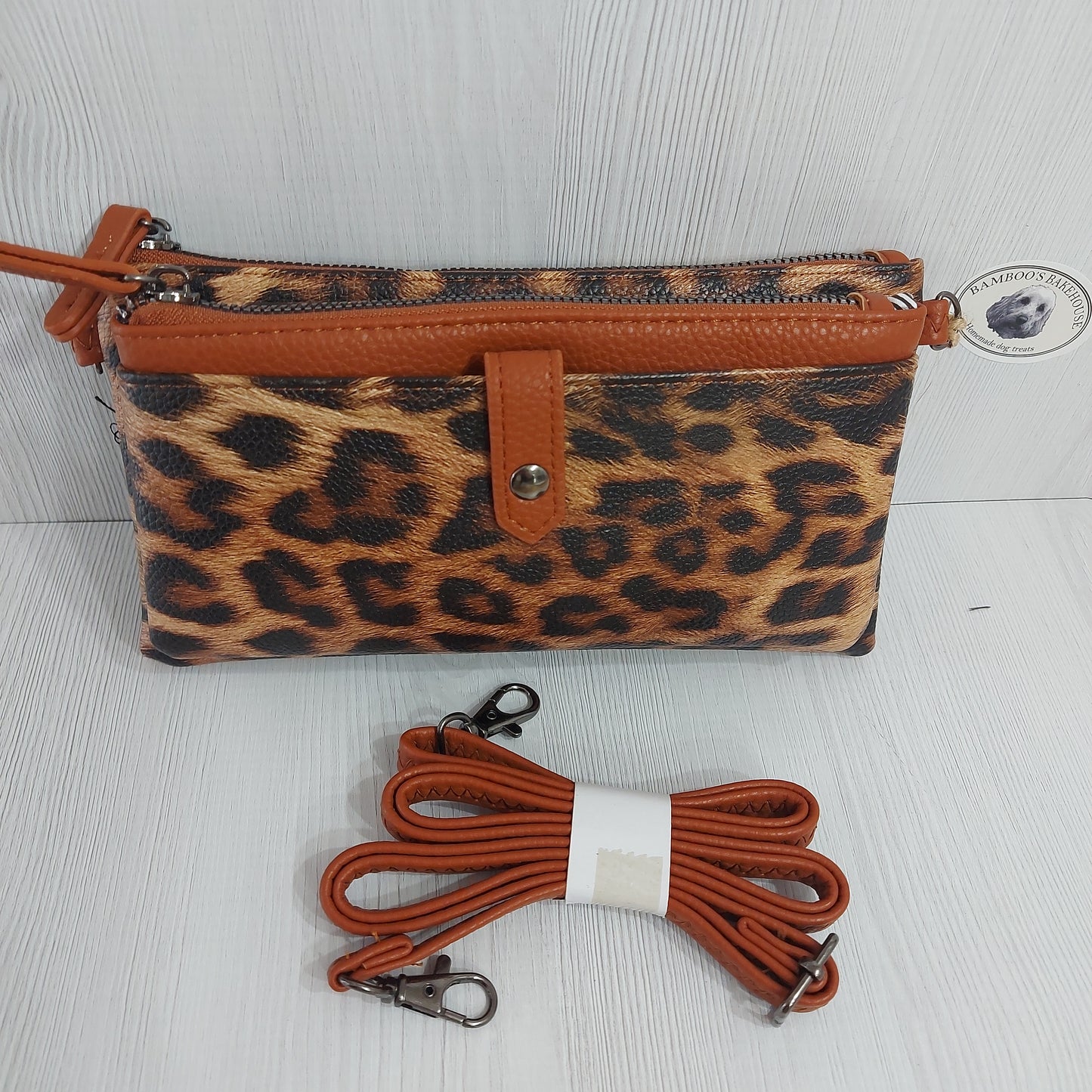 Brown & white animal print faux leather clutch bag