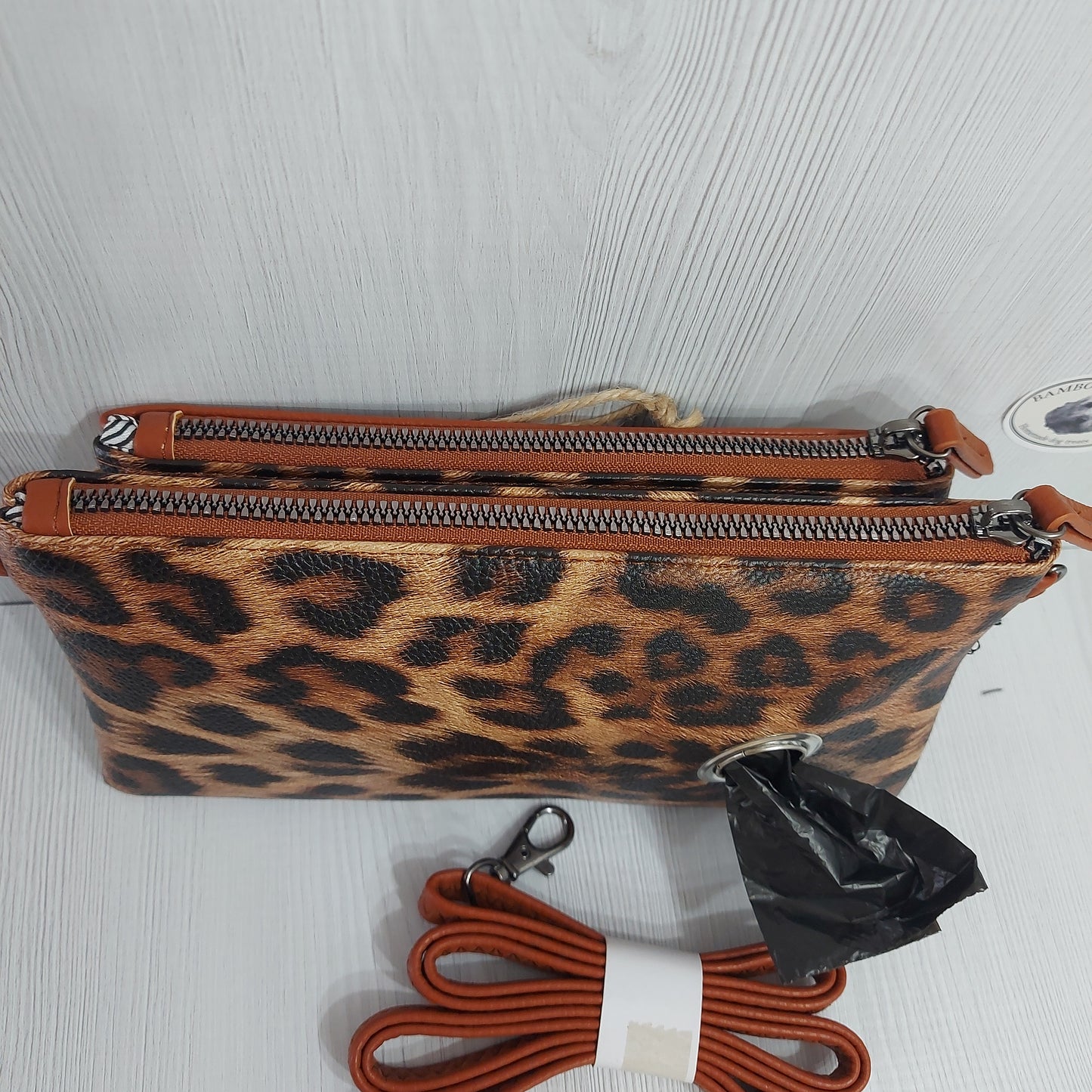 Brown & white animal print faux leather clutch bag